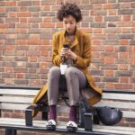 Woman on bench with Voys Freedom App
